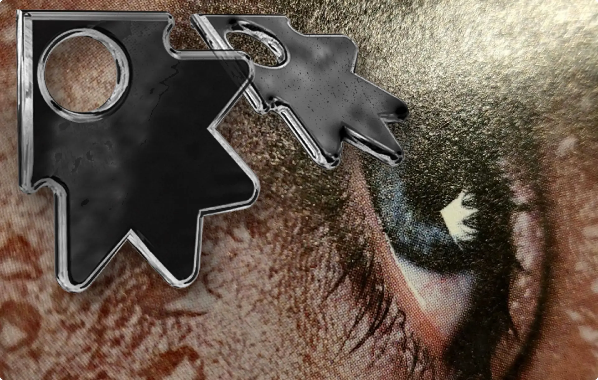 Chrome-edged black shapes over a close-up of an eye.